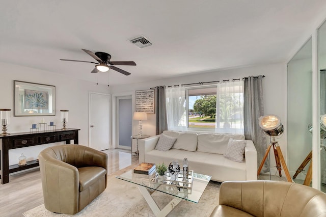 living area with ceiling fan