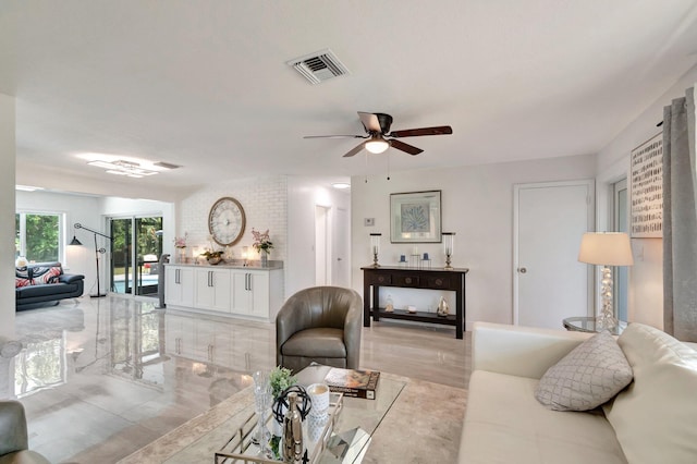 living room featuring a ceiling fan