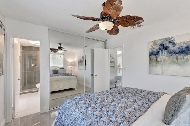 bedroom with a closet, a ceiling fan, ensuite bath, and light tile patterned flooring