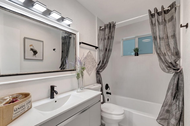 bathroom with toilet, vanity, and shower / bath combo
