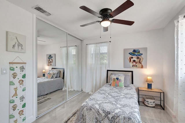 bedroom featuring a closet, a ceiling fan, and baseboards