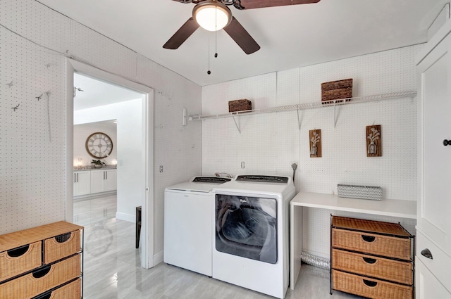 clothes washing area featuring washing machine and dryer, ceiling fan, and wallpapered walls