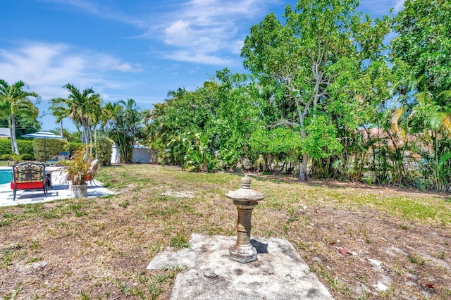 fenced backyard with a patio area