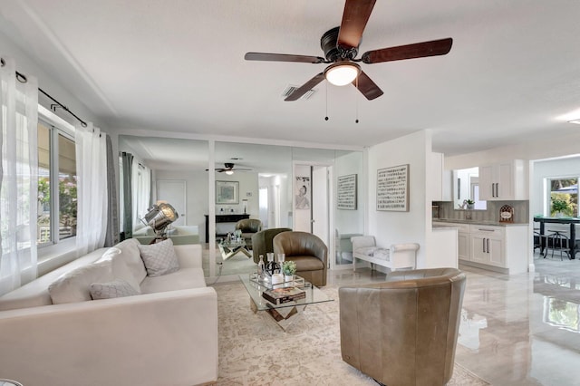 living room featuring a ceiling fan