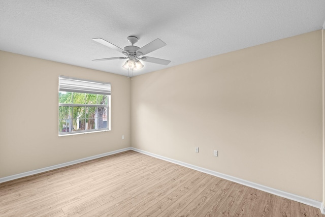 9226 Dupont Pl, Wellington, FL 33414 - unfurnished room with light wood-style floors, baseboards, ceiling fan, and a textured ceiling