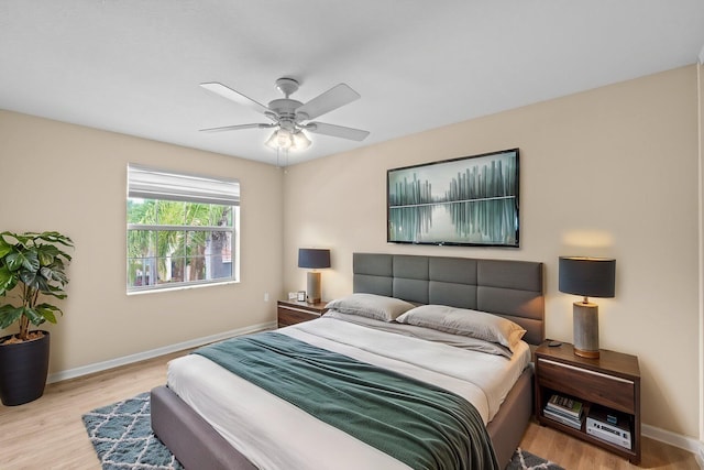 9226 Dupont Pl, Wellington, FL 33414 - bedroom with wood finished floors, baseboards, and a ceiling fan