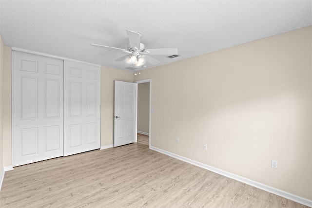 9226 Dupont Pl, Wellington, FL 33414 - unfurnished bedroom featuring light wood-style flooring, a closet, baseboards, and ceiling fan