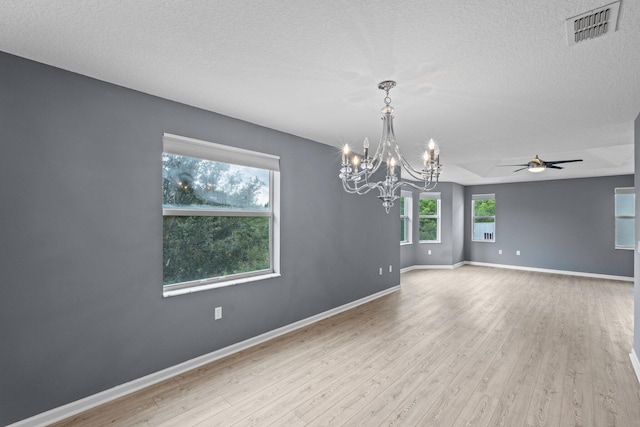 9226 Dupont Pl, Wellington, FL 33414 - unfurnished room featuring wood finished floors, a chandelier, ceiling fan, baseboards, and a textured ceiling