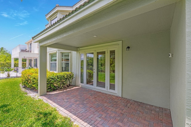 9226 Dupont Pl, Wellington, FL 33414 - entrance to property with stucco siding, a patio area, and a tile roof