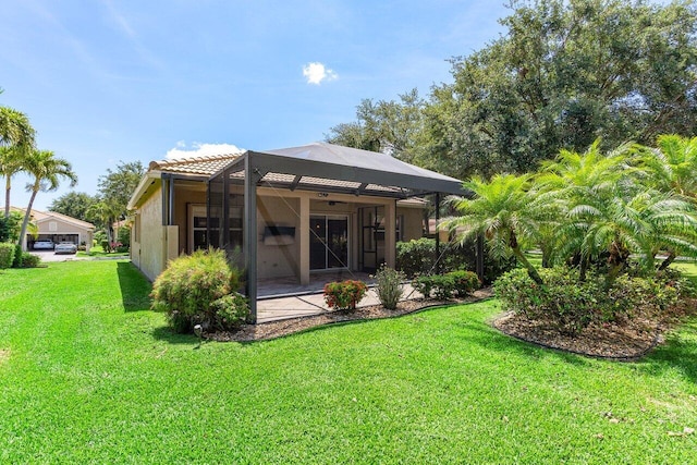 10887 Summerville Way, Boynton Beach, FL 33437 - back of property with a tiled roof, a yard, stucco siding, and a lanai