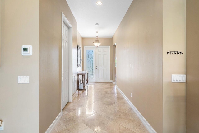 10887 Summerville Way, Boynton Beach, FL 33437 - corridor featuring baseboards and light tile patterned flooring
