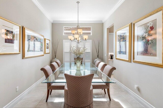 9037 Golden Mountain Cir, Boynton Beach, FL 33473 - dining area featuring a chandelier, crown molding, light tile patterned floors, and baseboards