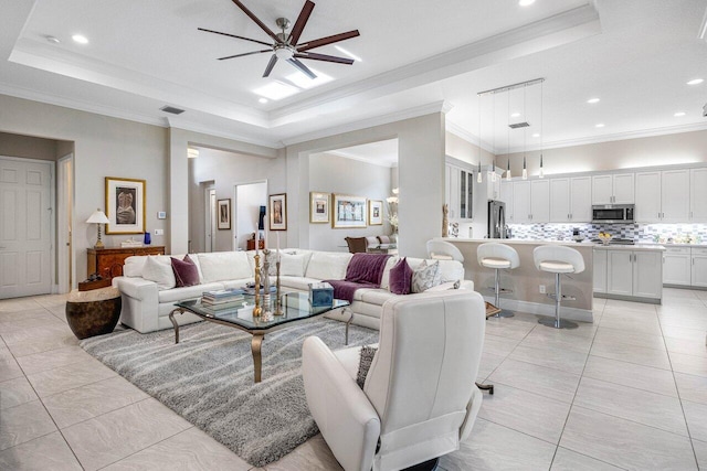9037 Golden Mountain Cir, Boynton Beach, FL 33473 - living area featuring a raised ceiling, a ceiling fan, ornamental molding, light tile patterned flooring, and recessed lighting