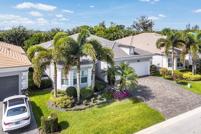 9037 Golden Mountain Cir, Boynton Beach, FL 33473 - view of front of home with a tile roof, a front lawn, decorative driveway, and stucco siding