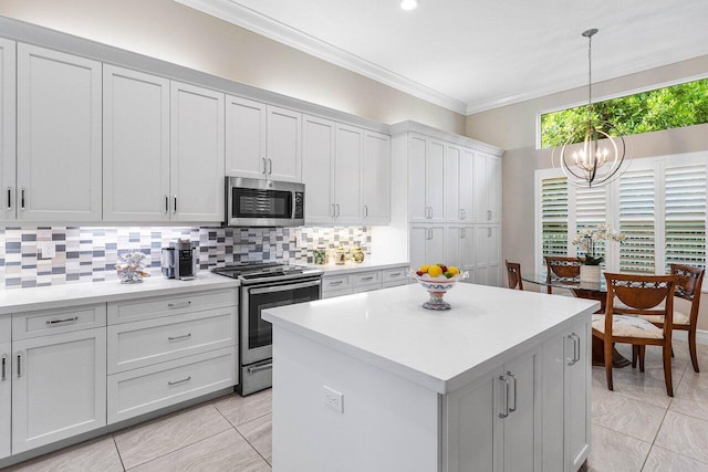 9037 Golden Mountain Cir, Boynton Beach, FL 33473 - kitchen featuring appliances with stainless steel finishes, a chandelier, ornamental molding, decorative backsplash, and light countertops