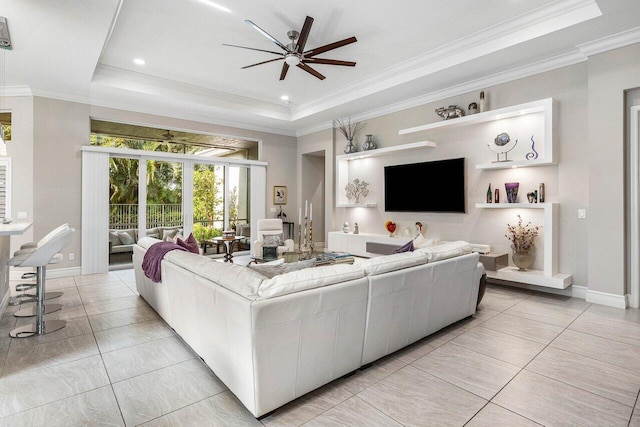 9037 Golden Mountain Cir, Boynton Beach, FL 33473 - living area featuring a tray ceiling, a ceiling fan, ornamental molding, baseboards, and light tile patterned floors