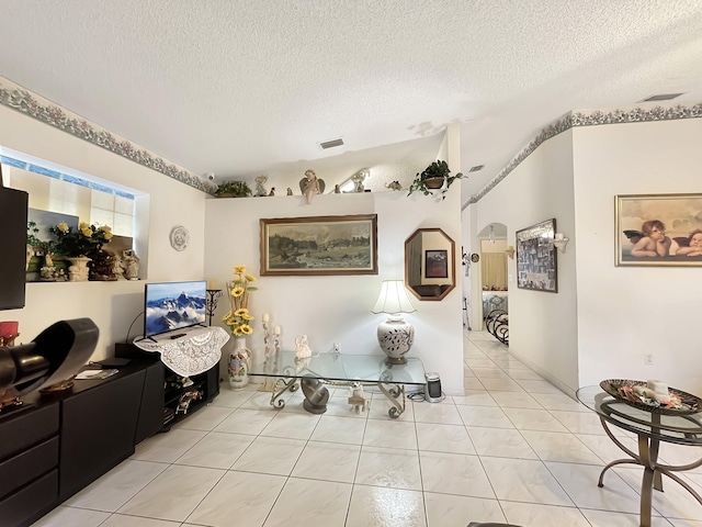 13824 SW 156th St, Miami, FL 33177 - living area featuring a textured ceiling, arched walkways, and light tile patterned floors