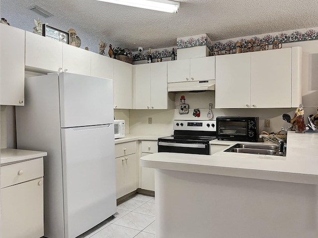 13824 SW 156th St, Miami, FL 33177 - kitchen with white appliances, under cabinet range hood, light countertops, a peninsula, and a textured ceiling