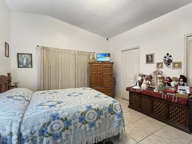 13824 SW 156th St, Miami, FL 33177 - bedroom with lofted ceiling, light tile patterned floors, and a textured ceiling