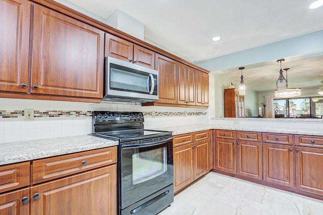kitchen featuring black electric range, stainless steel microwave, light marble finish floors, brown cabinets, and recessed lighting
