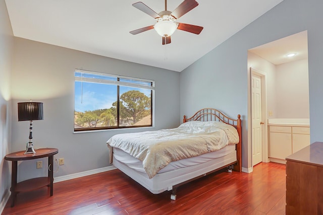 bedroom featuring wood finished floors, baseboards, and ceiling fan