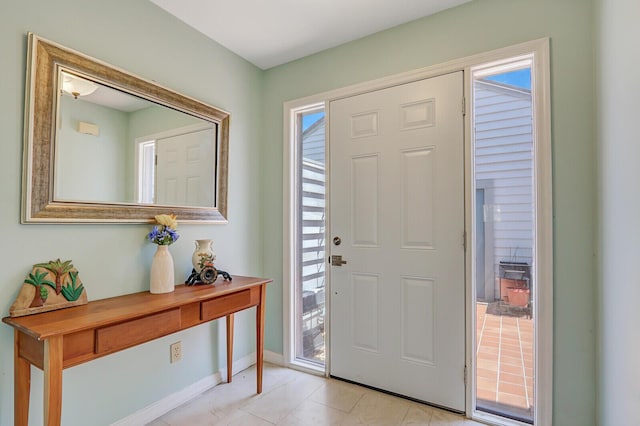 entrance foyer with plenty of natural light and baseboards