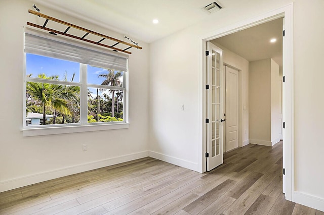 2510 Lake Dr N, Boynton Beach, FL 33435 - spare room with wood finished floors, baseboards, and recessed lighting