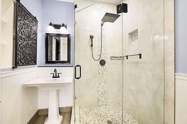 2510 Lake Dr N, Boynton Beach, FL 33435 - bathroom featuring a stall shower and wainscoting