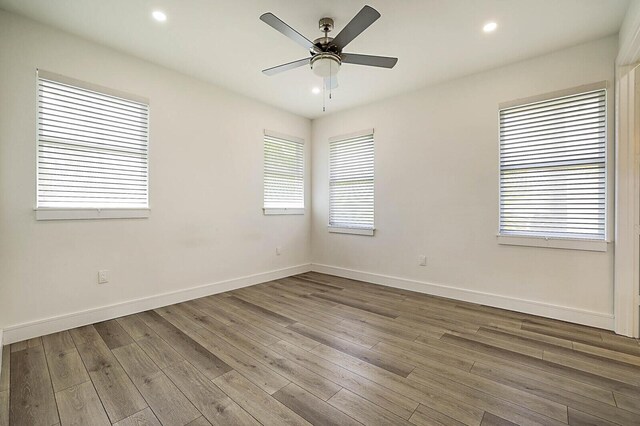 2510 Lake Dr N, Boynton Beach, FL 33435 - spare room featuring a ceiling fan, wood finished floors, baseboards, and recessed lighting