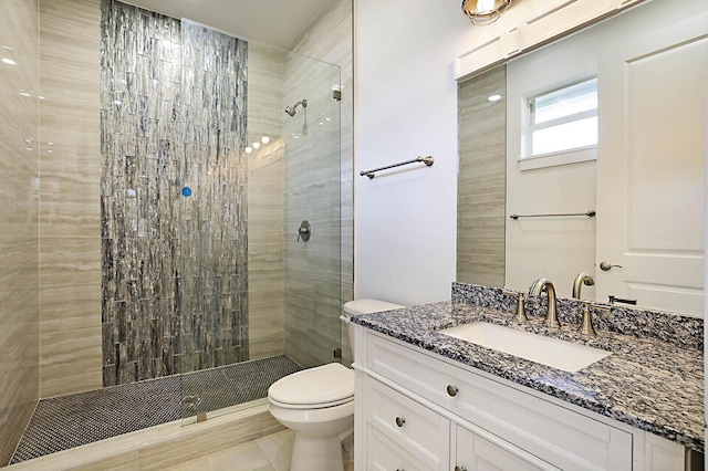 2510 Lake Dr N, Boynton Beach, FL 33435 - full bath with toilet, tiled shower, vanity, and tile patterned floors