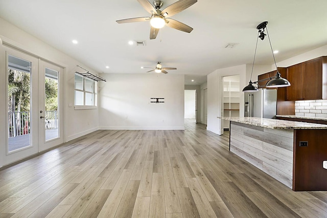 2510 Lake Dr N, Boynton Beach, FL 33435 - unfurnished living room with french doors, a ceiling fan, light wood finished floors, baseboards, and recessed lighting