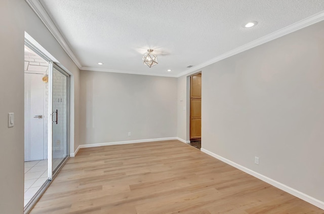 10095 45th Ter S Unit 443, Boynton Beach, FL 33436 - unfurnished room featuring a textured ceiling, light wood finished floors, ornamental molding, baseboards, and recessed lighting