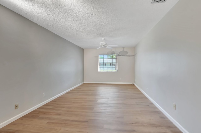 10095 45th Ter S Unit 443, Boynton Beach, FL 33436 - spare room with a textured ceiling, light wood-style flooring, a ceiling fan, and baseboards
