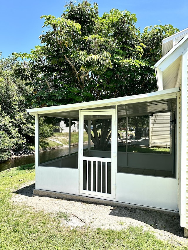 view of patio featuring a sunroom