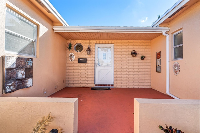 6260 SW 10th Ct, North Lauderdale, FL 33068 - property entrance with brick siding, a porch, and stucco siding