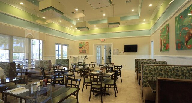 7779 Butera Plz, Delray Beach, FL 33446 - lobby with crown molding, a towering ceiling, and a wainscoted wall