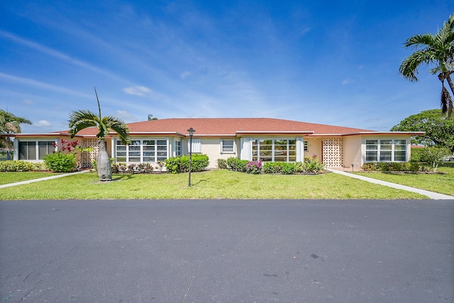 4585 NW 3rd St Unit D, Delray Beach, FL 33445 - ranch-style home featuring a front yard and stucco siding