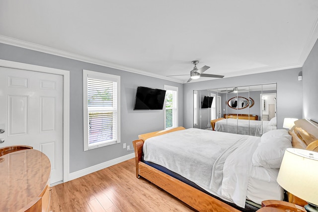 4585 NW 3rd St Unit D, Delray Beach, FL 33445 - bedroom with crown molding, baseboards, light wood-type flooring, and a ceiling fan