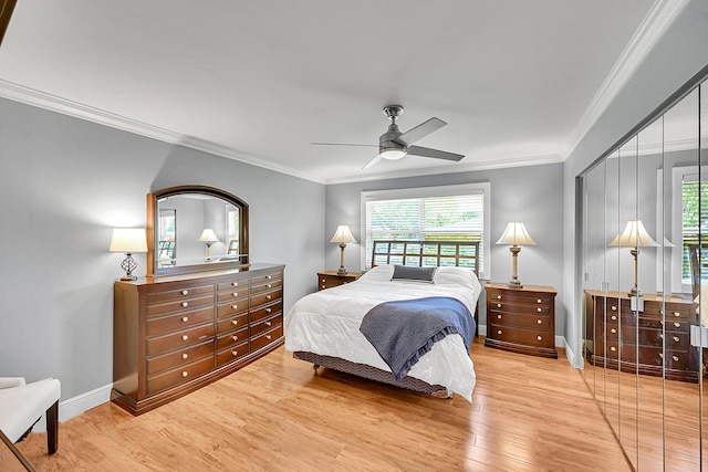 4585 NW 3rd St Unit D, Delray Beach, FL 33445 - bedroom with light wood-style flooring, crown molding, a ceiling fan, baseboards, and a closet