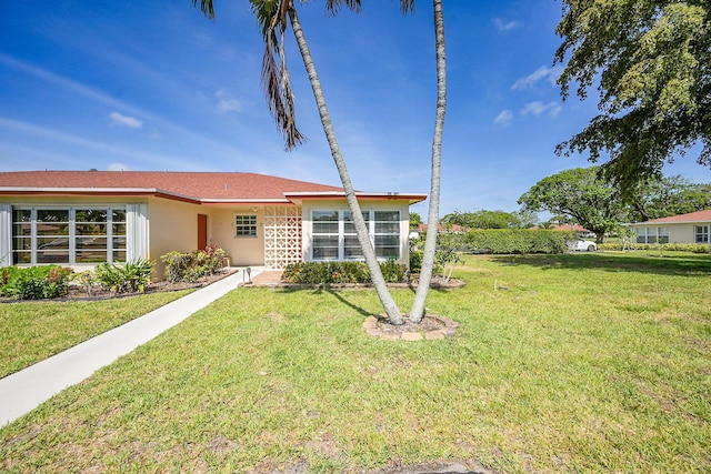 4585 NW 3rd St Unit D, Delray Beach, FL 33445 - single story home with a front yard and stucco siding
