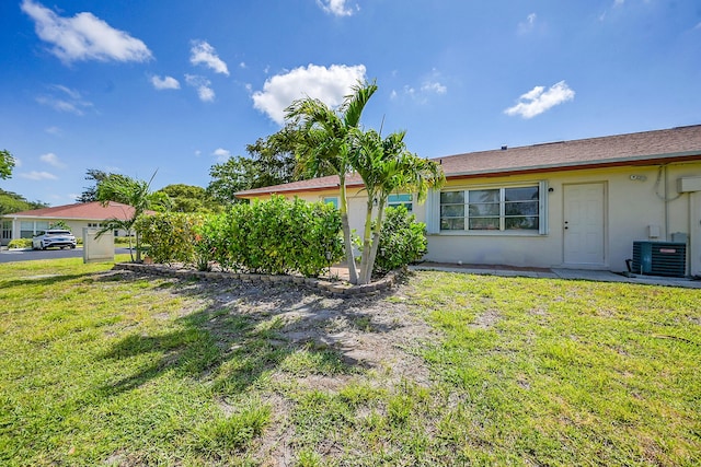 4585 NW 3rd St Unit D, Delray Beach, FL 33445 - view of green lawn with cooling unit