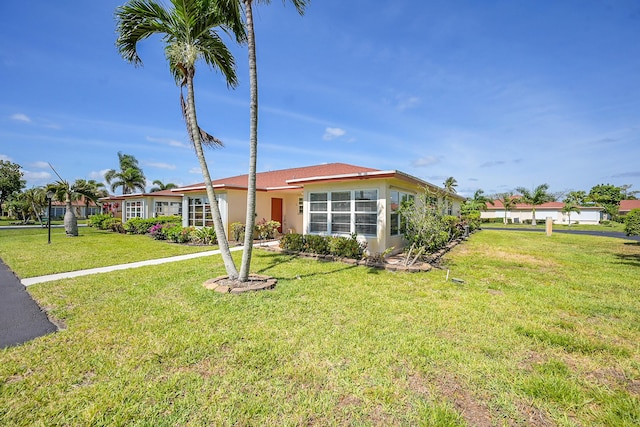 4585 NW 3rd St Unit D, Delray Beach, FL 33445 - single story home featuring a front lawn and stucco siding