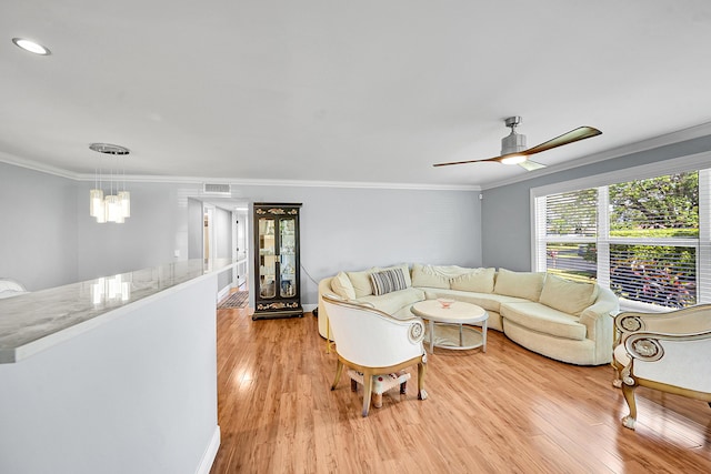 4585 NW 3rd St Unit D, Delray Beach, FL 33445 - living room with light wood-type flooring, crown molding, a ceiling fan, a chandelier, and baseboards