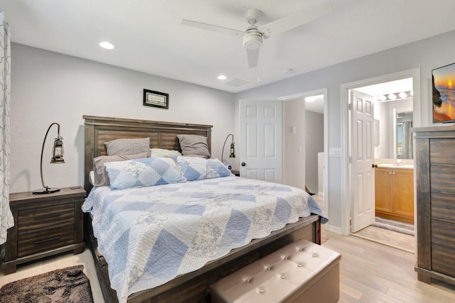 2556 Marshfield Ct, Port Saint Lucie, FL 34953 - bedroom with light wood-type flooring, recessed lighting, ensuite bathroom, a ceiling fan, and baseboards
