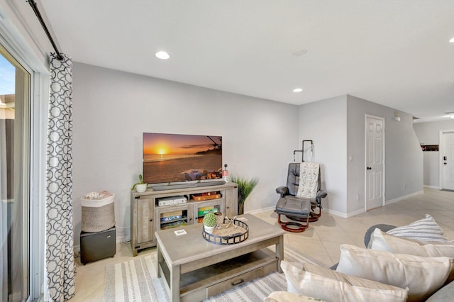 2556 Marshfield Ct, Port Saint Lucie, FL 34953 - living room with light tile patterned floors, recessed lighting, and baseboards