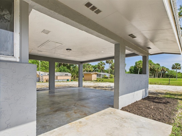 view of patio featuring a carport