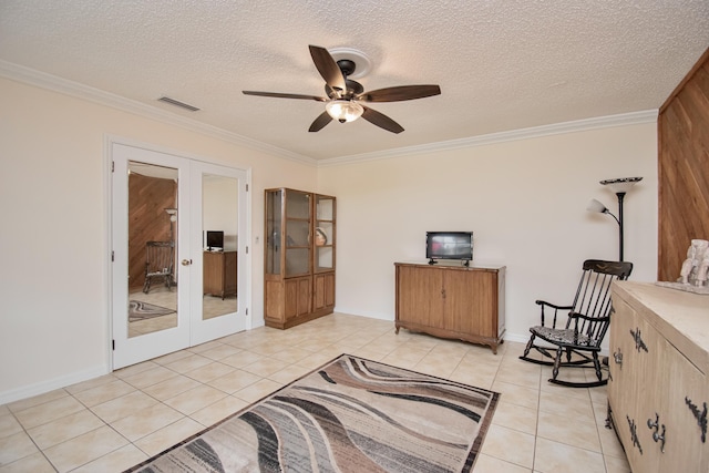 5123 Adams Rd, Delray Beach, FL 33484 - living area with french doors, crown molding, light tile patterned floors, ceiling fan, and a textured ceiling