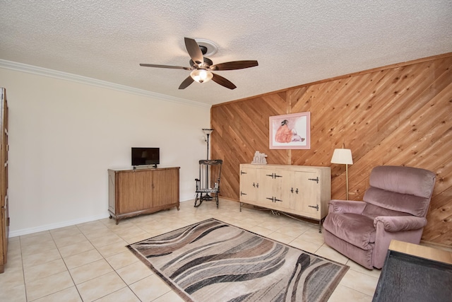5123 Adams Rd, Delray Beach, FL 33484 - living area featuring light tile patterned floors, a ceiling fan, crown molding, wood walls, and a textured ceiling