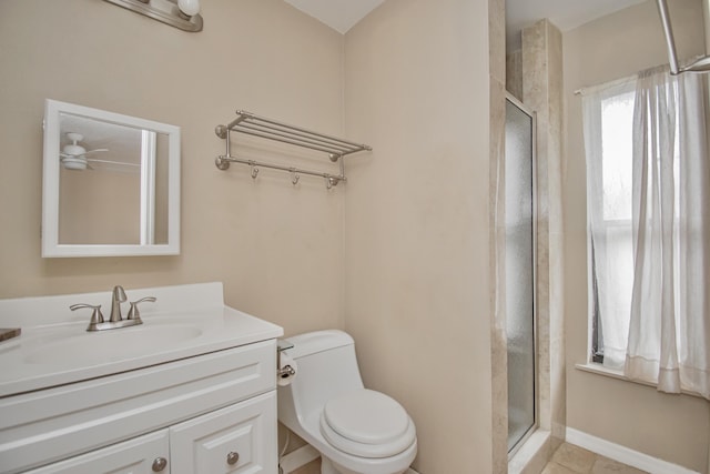 5123 Adams Rd, Delray Beach, FL 33484 - bathroom featuring a stall shower, toilet, vanity, tile patterned flooring, and a ceiling fan