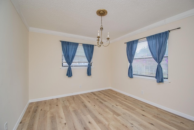 5123 Adams Rd, Delray Beach, FL 33484 - spare room with a textured ceiling, wood finished floors, a chandelier, and baseboards